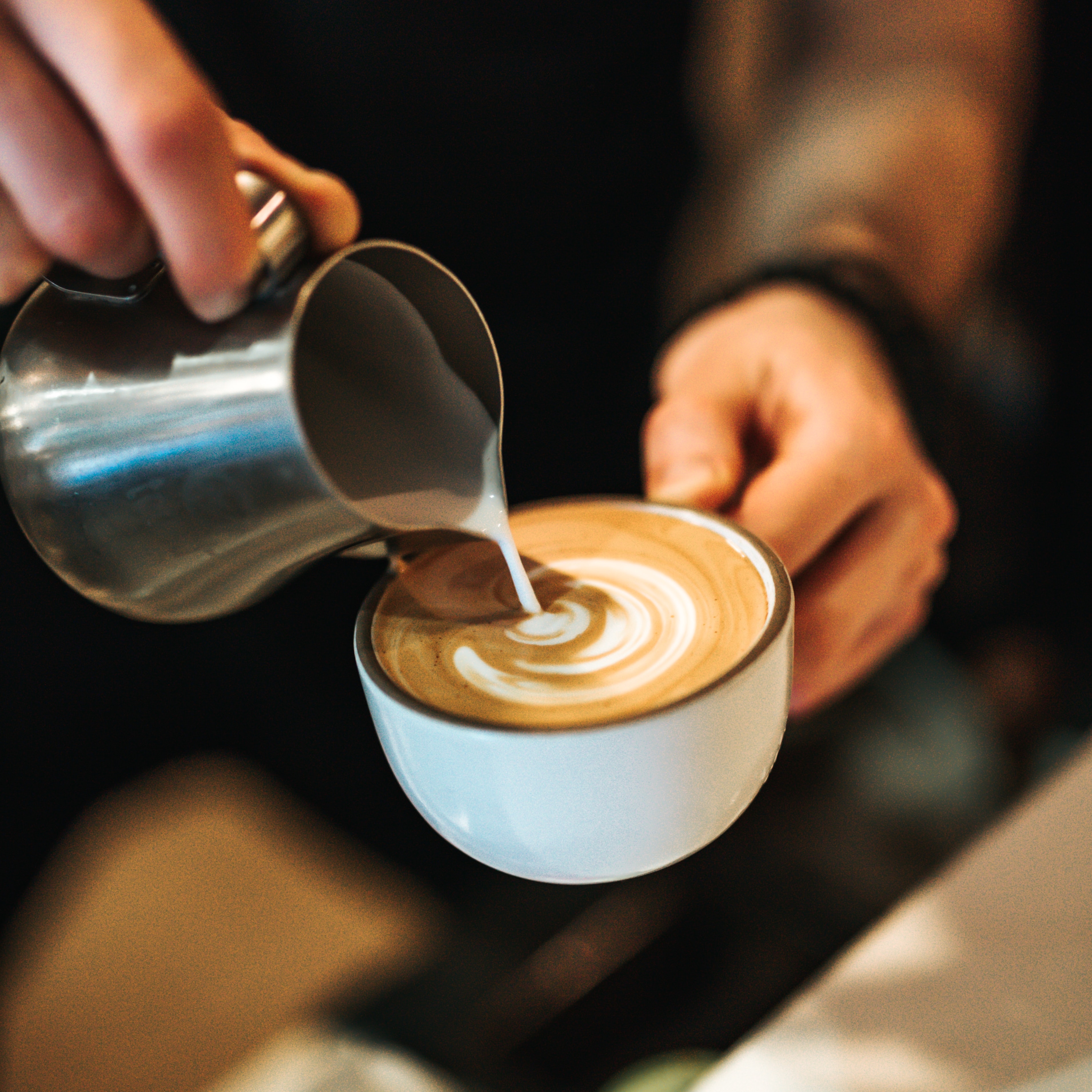 Barista making a latte